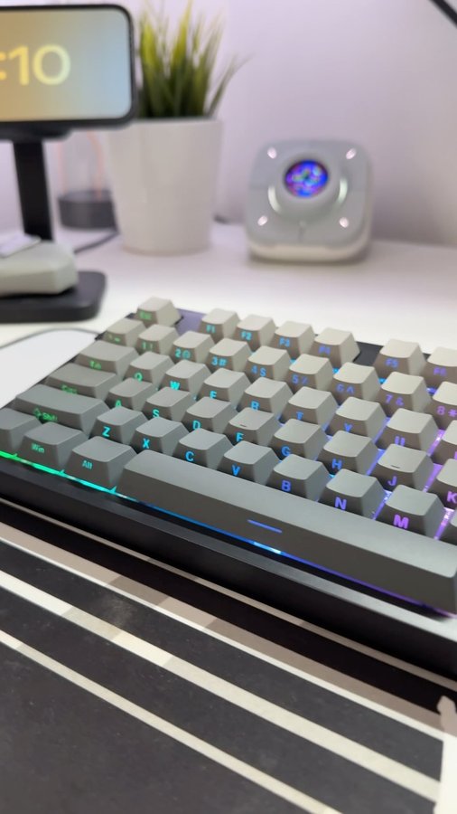 Instagram post by @developeradam for DAREU. Caption reads: [...] a 87 key wireless RGB gaming keeb from....