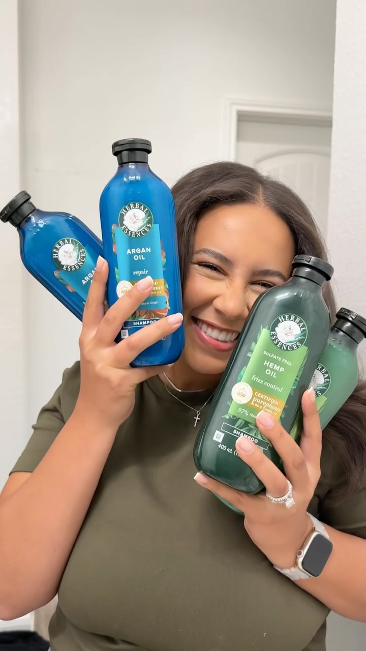 Instagram post by @julisimmons_ for Herbal Essences. Caption reads: Switching up my hair from curls to sleek straight....