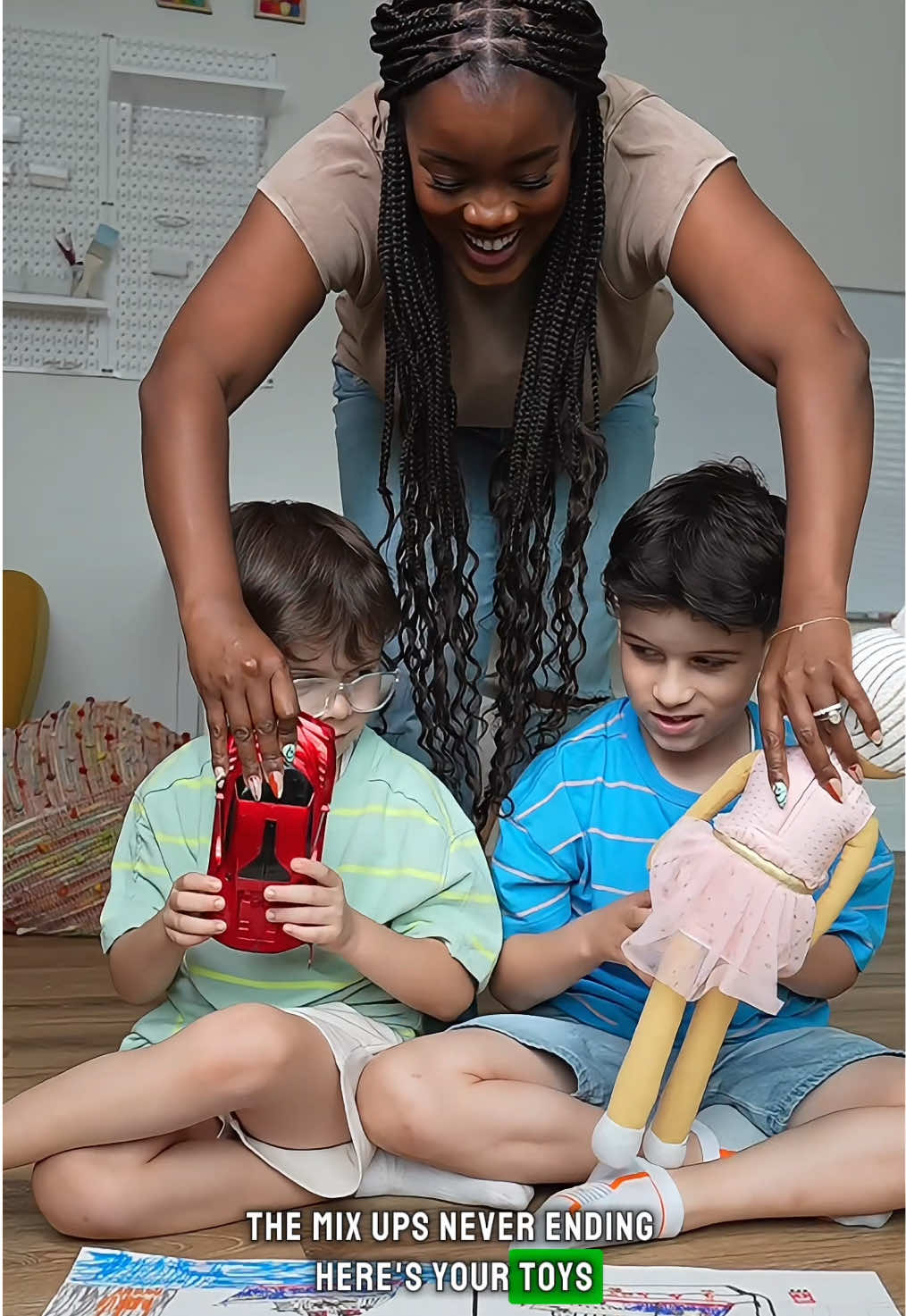 TikTok post by @team2moms for GoGo squeeZ. Caption reads: Parenting twins means guessing games occasionally....