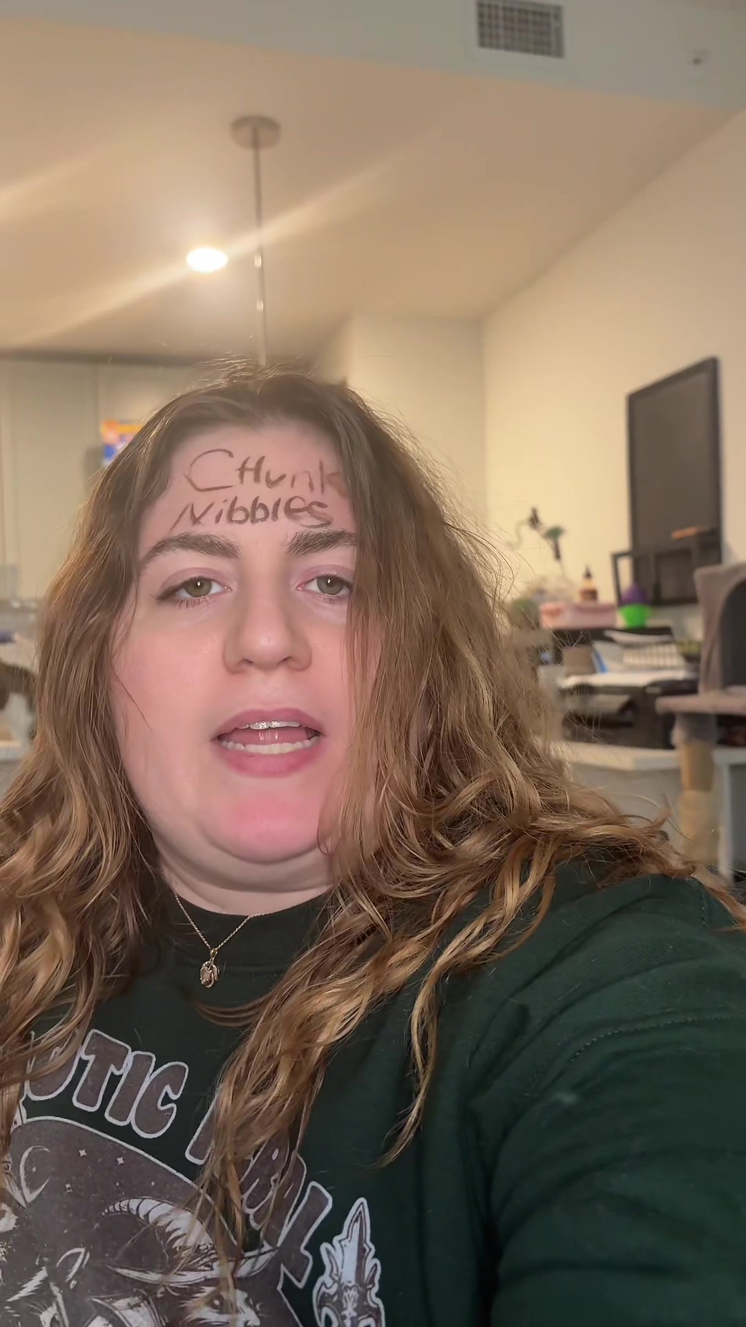 TikTok post by @ellaboyett for Chunk Nibbles. Caption reads: I promised a tattoo. This is me fufilling that....