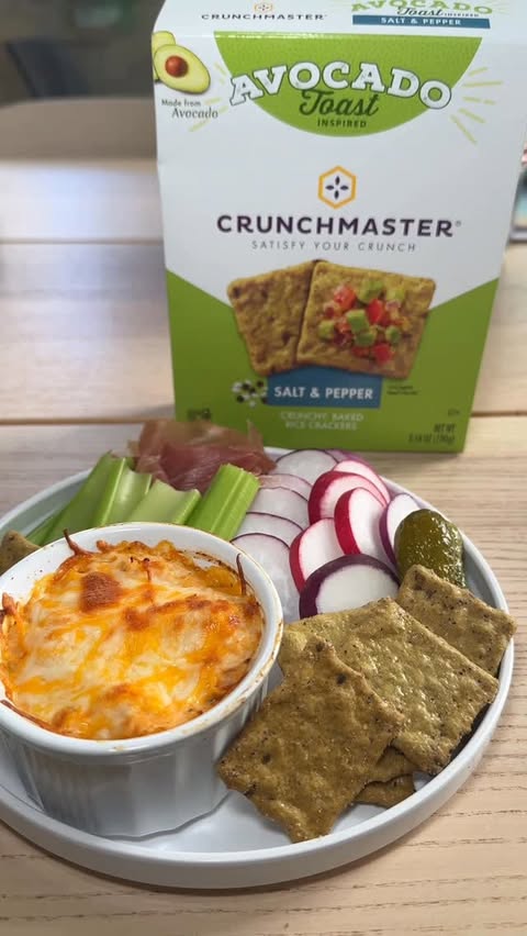 Instagram post by @biteswithesther for Crunchmaster Crackers. Caption reads: #ad savory snack plate with @crunchmastercrackers....