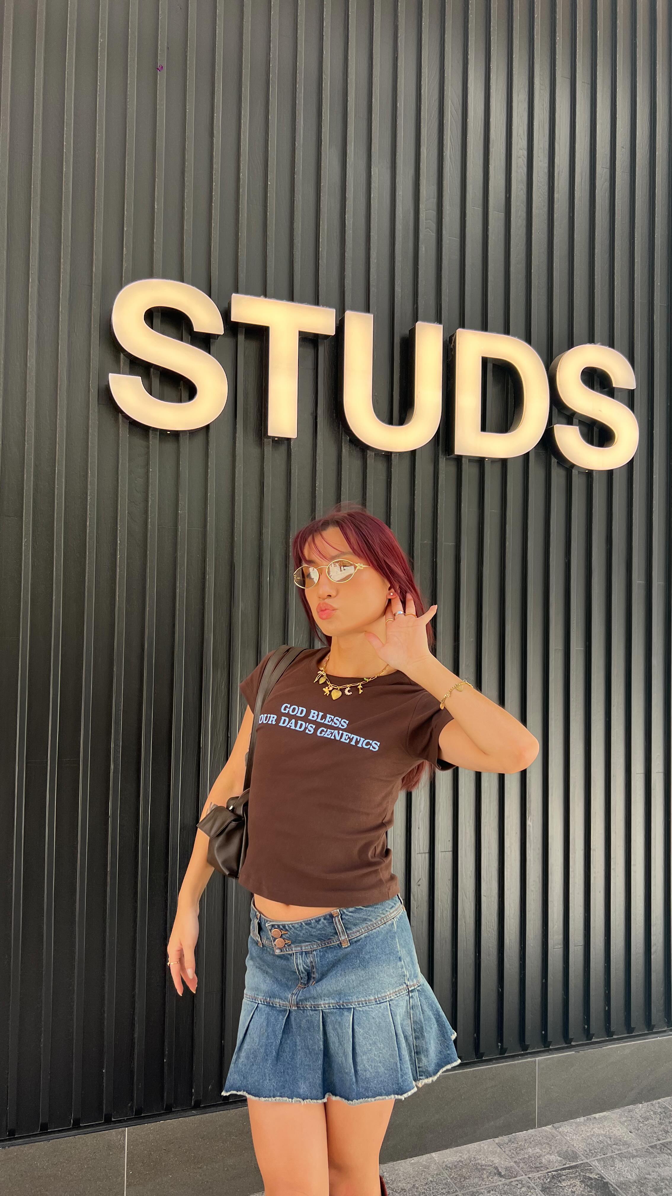 Instagram post by @flawlesskevin for Studs. Caption reads: Getting my ears pierced for the first time EVER....