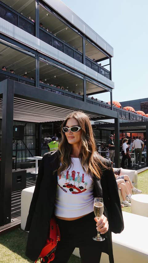 Instagram post by @amypejkovic for Audi. Caption reads: Trackside with Audi — what a history making year,....