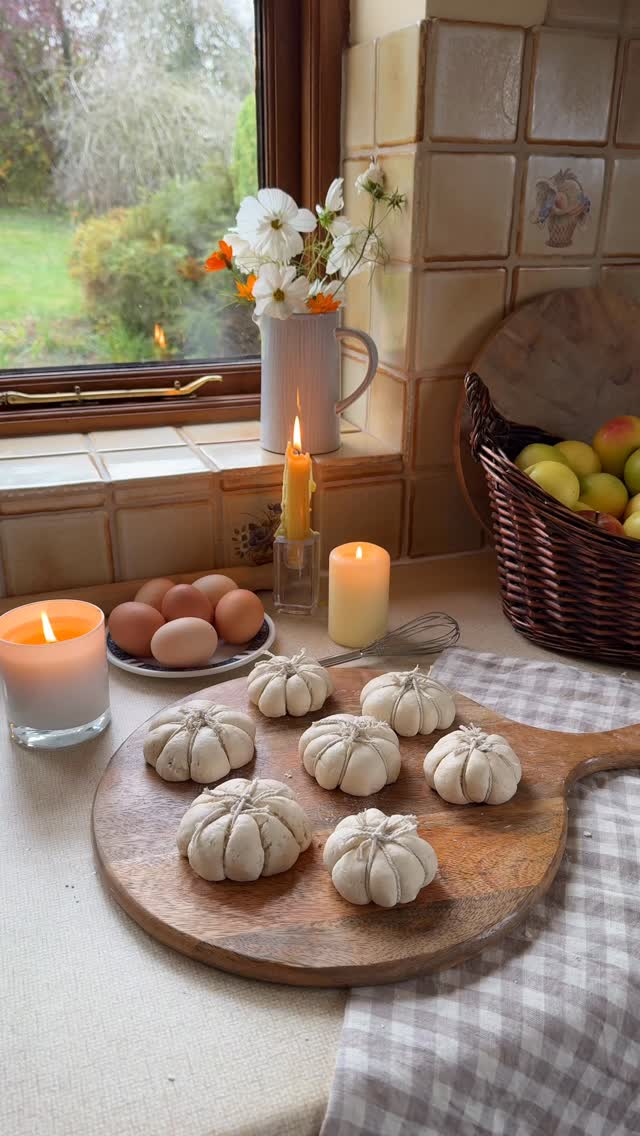 Instagram post by @sisterssharingstyle for Holland & Barrett. Caption reads: ad A cosy afternoon baking pumpkin shaped bread in....
