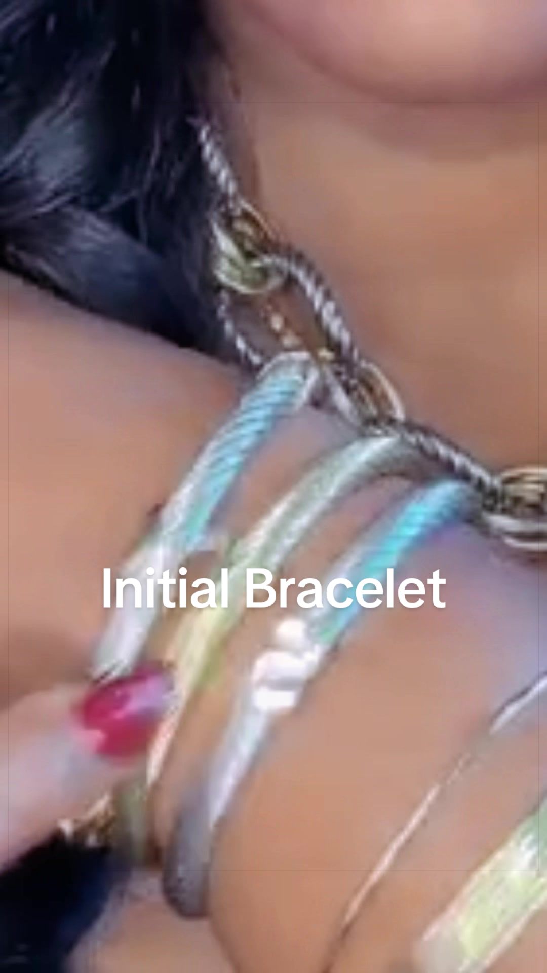 TikTok post by @shopwithallthingskokeaux for Aprilery Jewelry-US. Caption reads: [...] #stacking #braceletstack @Aprilery....