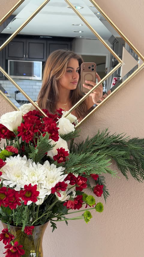 Instagram post by @jamienkidd for Azazie. Caption reads: A little Christmas bouquet 🎄🌹.