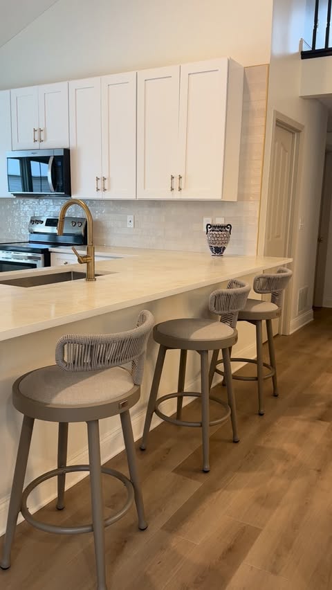 Instagram post by @homebyxi for PURPLE LEAF. Caption reads: Before and after on my mom’s kitchen project! 

We....