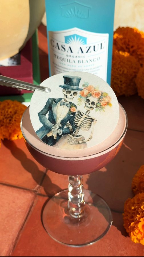 Instagram post by @pilarvarelaa for Casa Azul Spirits. Caption reads: Raise a glass to the spirits with La Última Flor....