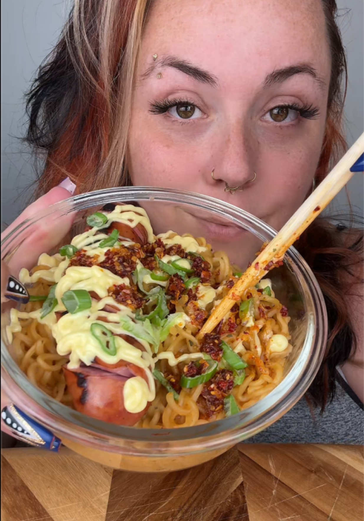 TikTok post by @tashies.yummies for Nongshim USA. Caption reads: @Nongshim USA ramen😍🥰 Shoutout to the last....