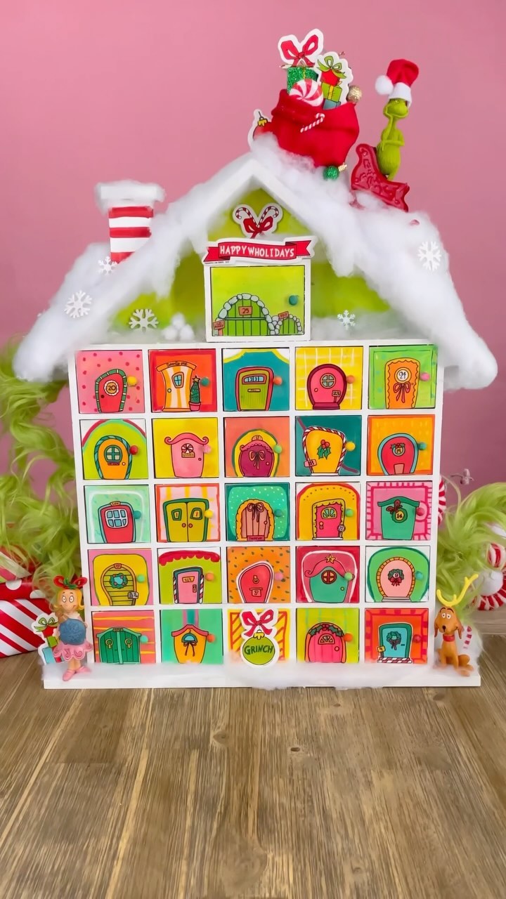 Instagram post by @agirlandagluegun for Hobby Lobby. Caption reads: Get ready to Countdown Christmas in true GRINCH....