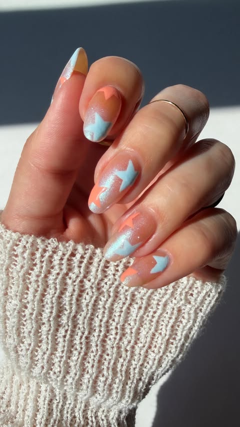 Instagram post by @thatglosssauce for Nails.INC. Caption reads: [...] star nail art! ✨🍑🩵💫 Products used:....