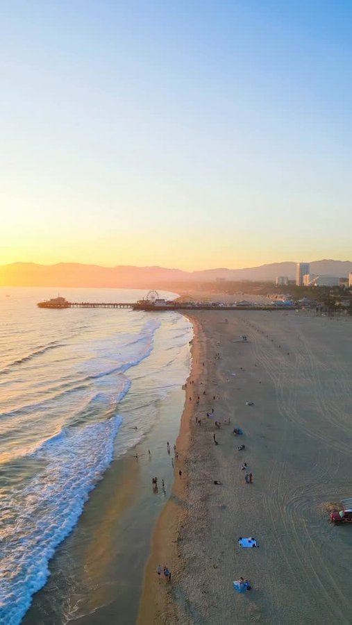 Instagram post by @adriianguuzman for Discover Los Angeles. Caption reads: Happy Sunday from Santa Monica 🌞

Promise more....
