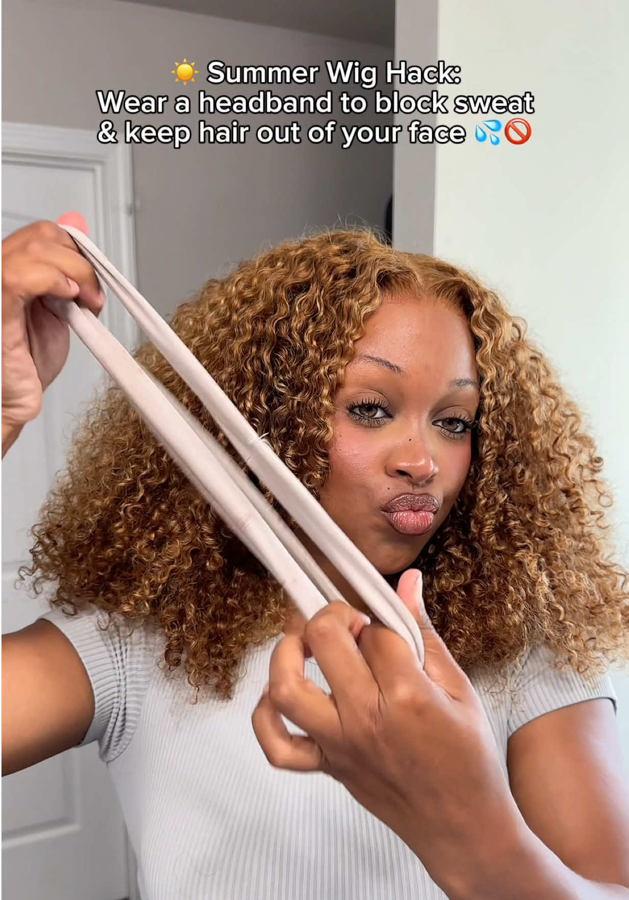 TikTok post by @arenee.mua for Curlyme. Caption reads: [...] wig hack: HEADBAND. Hair: @CurlyMe Hair Wear....