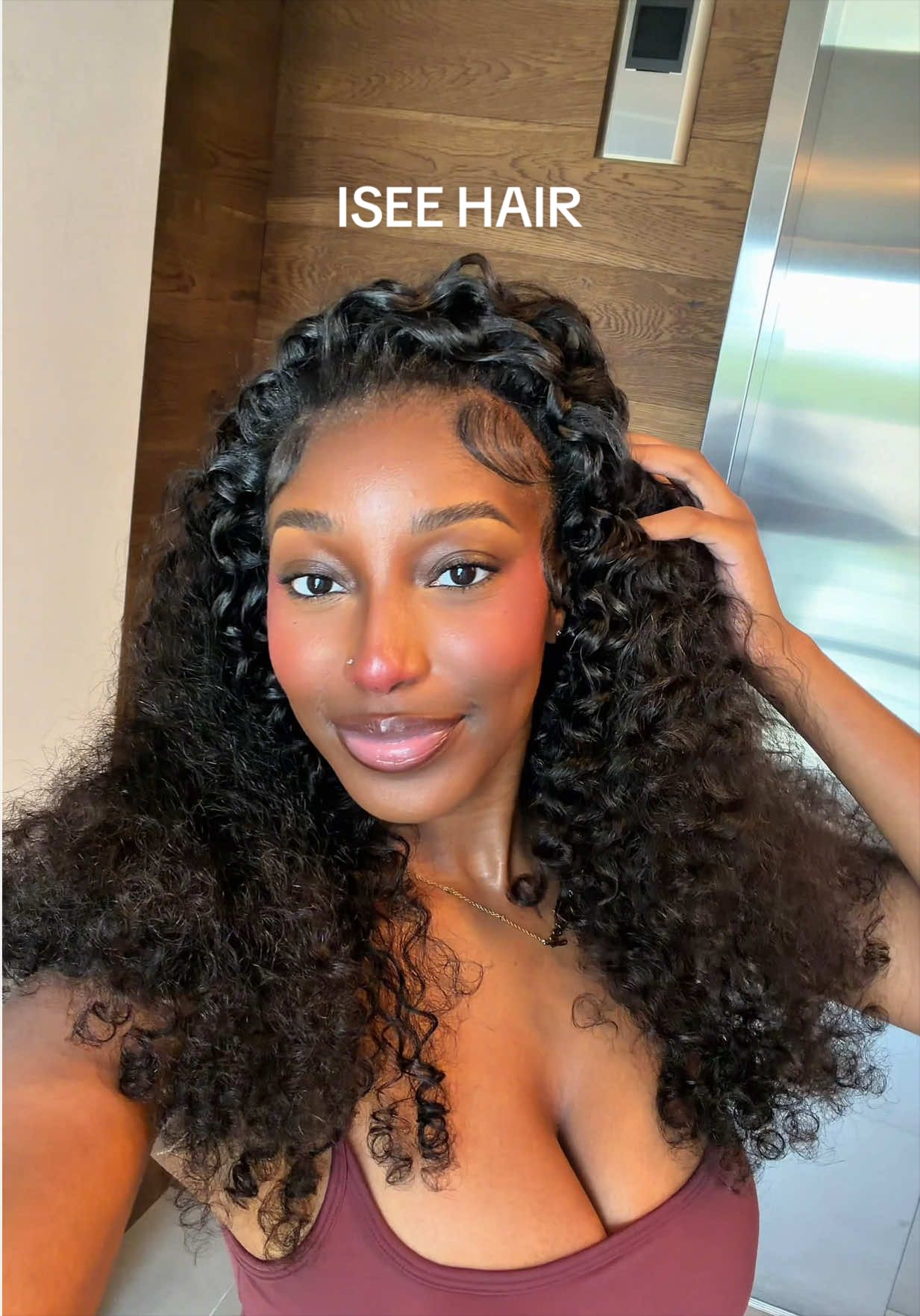 TikTok post by @kkelseyk_ for ISEE Hair. Caption reads: [...] with this Burmese curly half wig from....