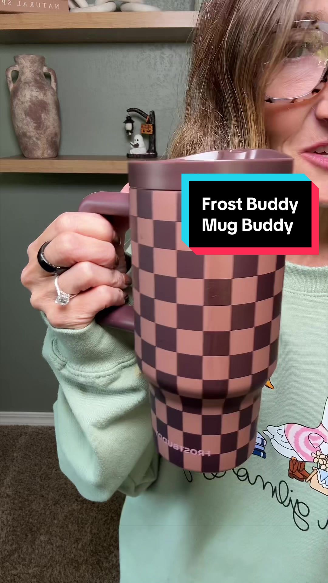 TikTok post by @melaniedavisfinds for Frost Buddy. Caption reads: @Frost Buddy #frostbuddy #mugbuddy #coffee [...].