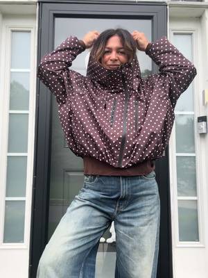 TikTok post by @thefortysomething for PUFFIT UK Shop. Caption reads: The polka dot rainjacket by @PUFFIT.US....