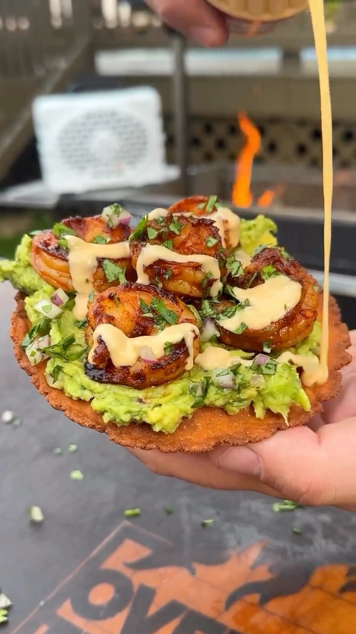 Instagram post by @overthefirecooking for Turtlebox. Caption reads: Chili Oil Shrimp Tostadas with @turtleboxaudio....