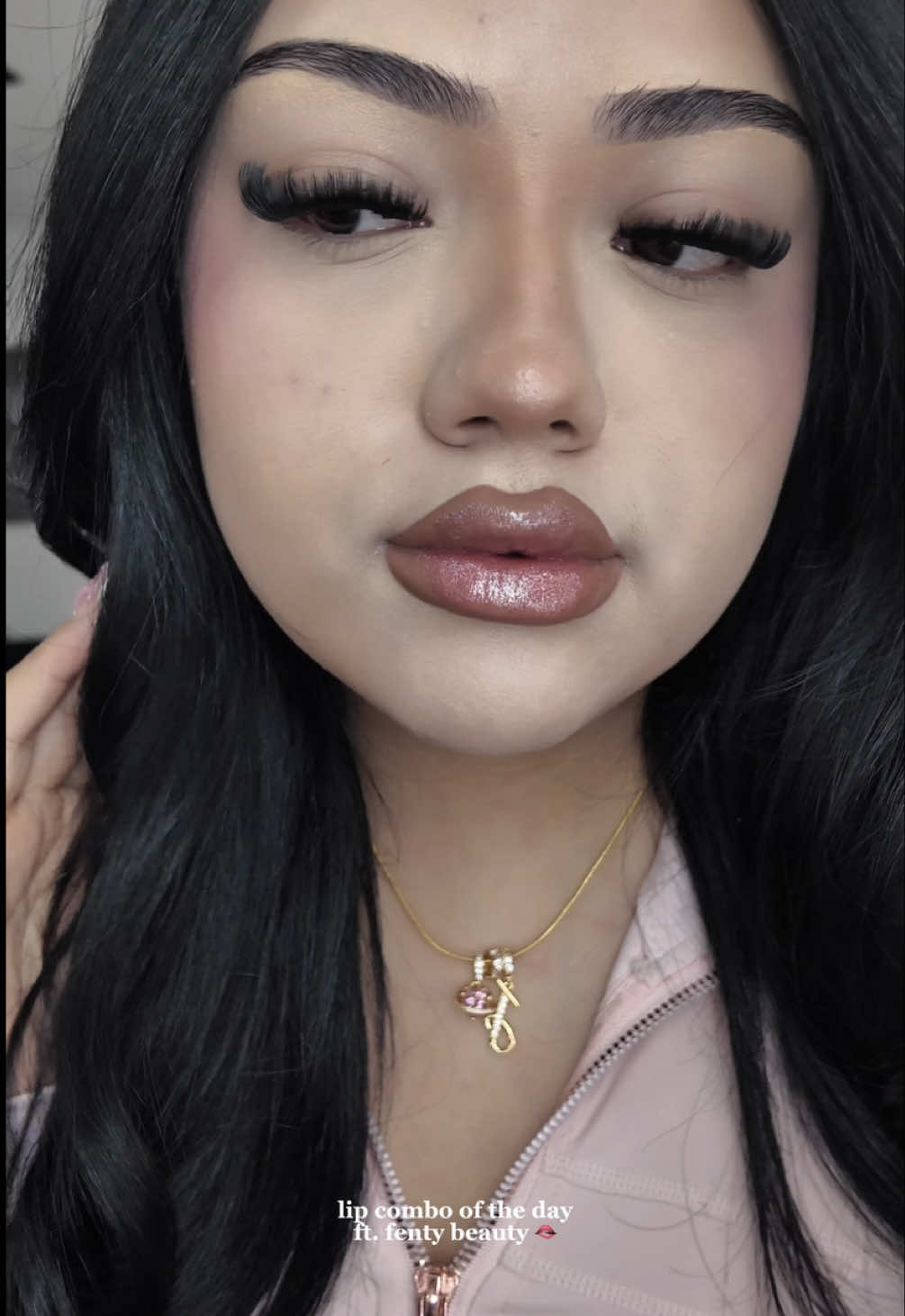 TikTok post by @vidadejannet for Fenty Beauty. Caption reads: [...] out rubbabandz” & gloss “fu$y” 🤍 @Fenty....