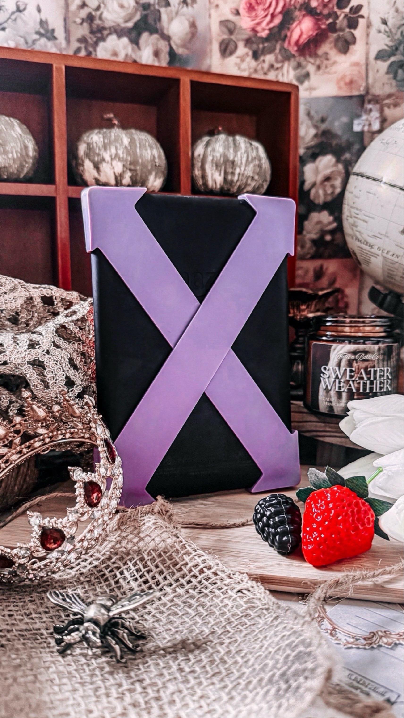 Instagram post by @nice_to_read_ya for Strapsicle. Caption reads: [...] these gorgeous purple straps from....