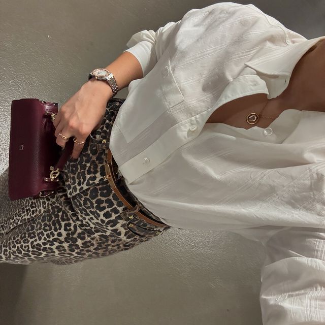 Instagram post by @asoothesizzler for Etienne Aigner AG. Caption reads: Obsessed about my look the New FW #AIGNER Bag, and....