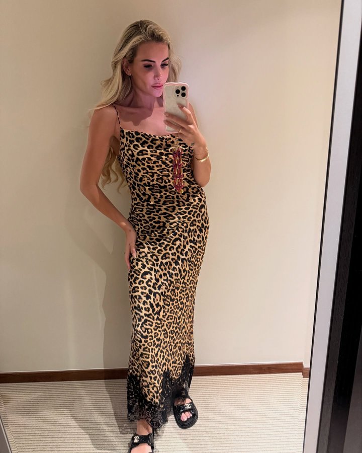 Instagram post by @georgiakousoulou for Never Fully Dressed. Caption reads: First of the Dubai mirror pics ..🩷📸.