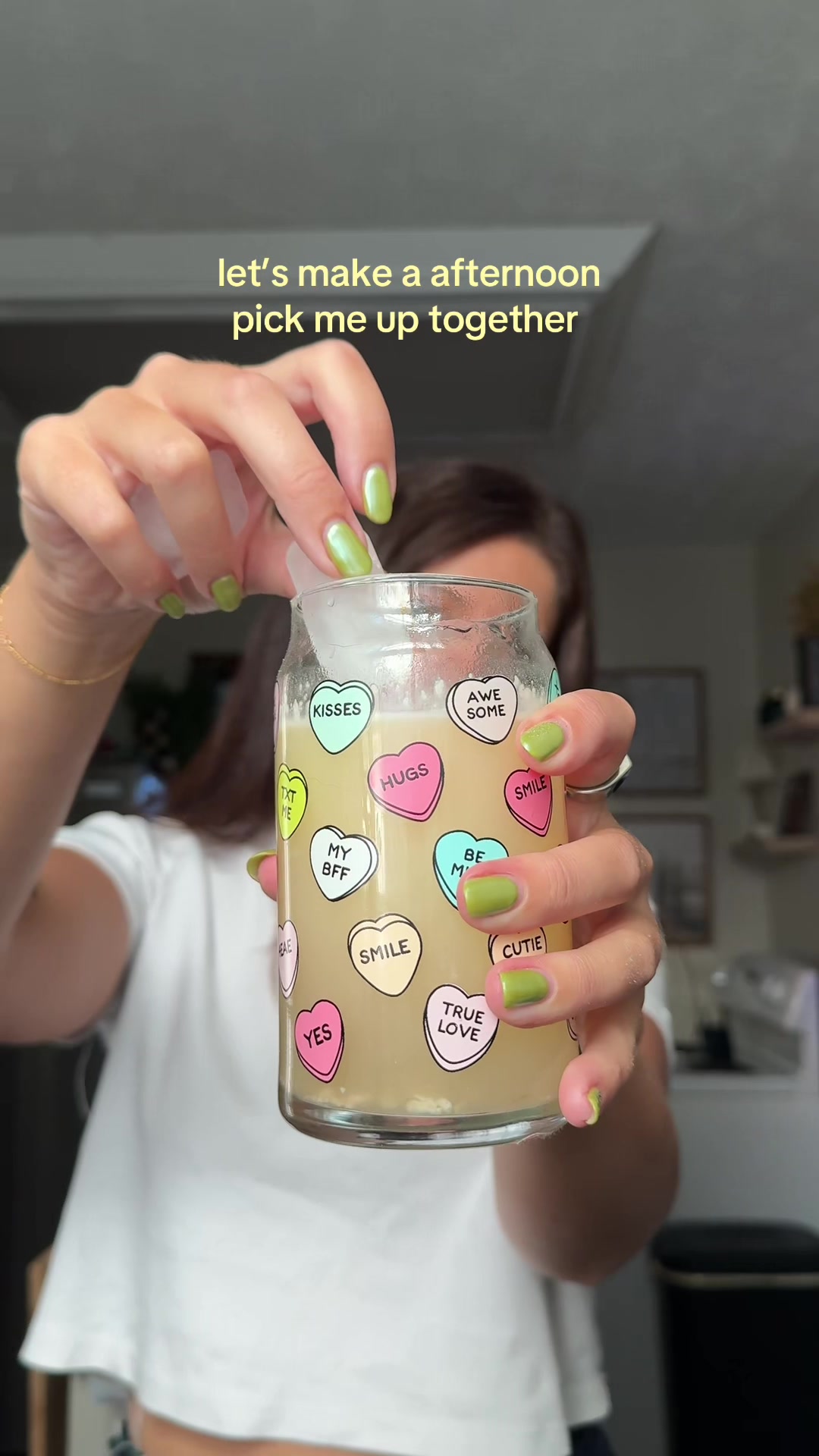 TikTok post by @kaymbell for Javy Coffee. Caption reads: If you saw the sticker on the bottom of this cup,....