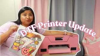 YouTube post by @bevscraftystudio for TeckWrapcraft. Caption reads: PINK DTF PRINTER UPDATE | LET'S MAKE A DTF....