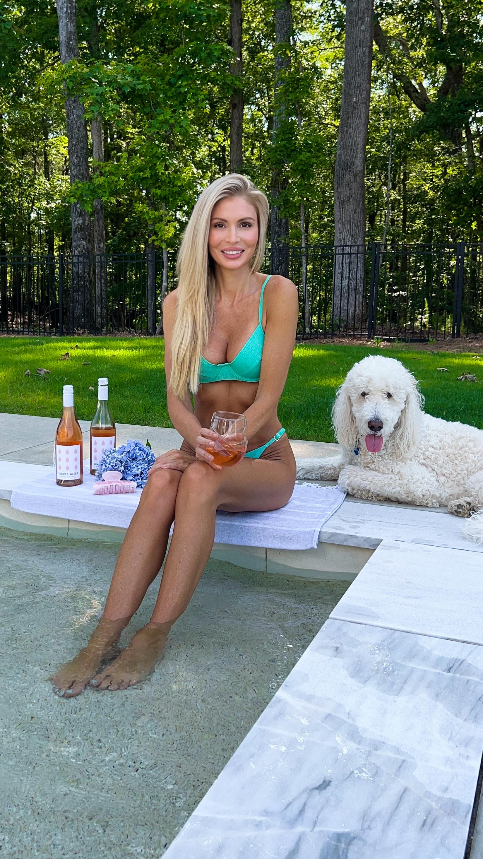 Instagram post by @tay_brandenburg for Summer Water. Caption reads: Working harder than most. (On my tan.) 🔆....