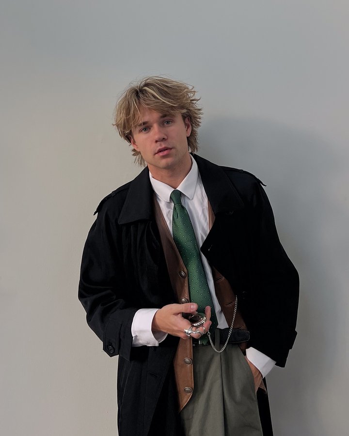 Instagram post by @itsslavik for Brooks Brothers. Caption reads: Tied up in a timeless look ⏳ @brooksbrothers.