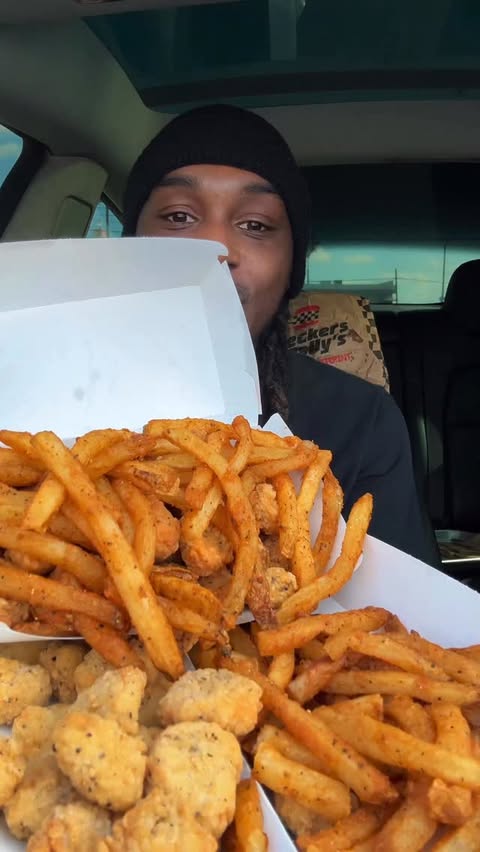 Instagram post by @dutchies_munchies for Checkers & Rally’s. Caption reads: Happy national superhero day from @checkersrallys....