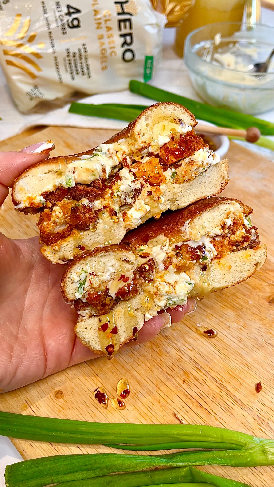 Instagram post by @fitfoodiestasia for Hero Bread. Caption reads: 🥯 HOMEMADE CREAM CHEESE KIT + GIFT-CARD GIVEAWAY....