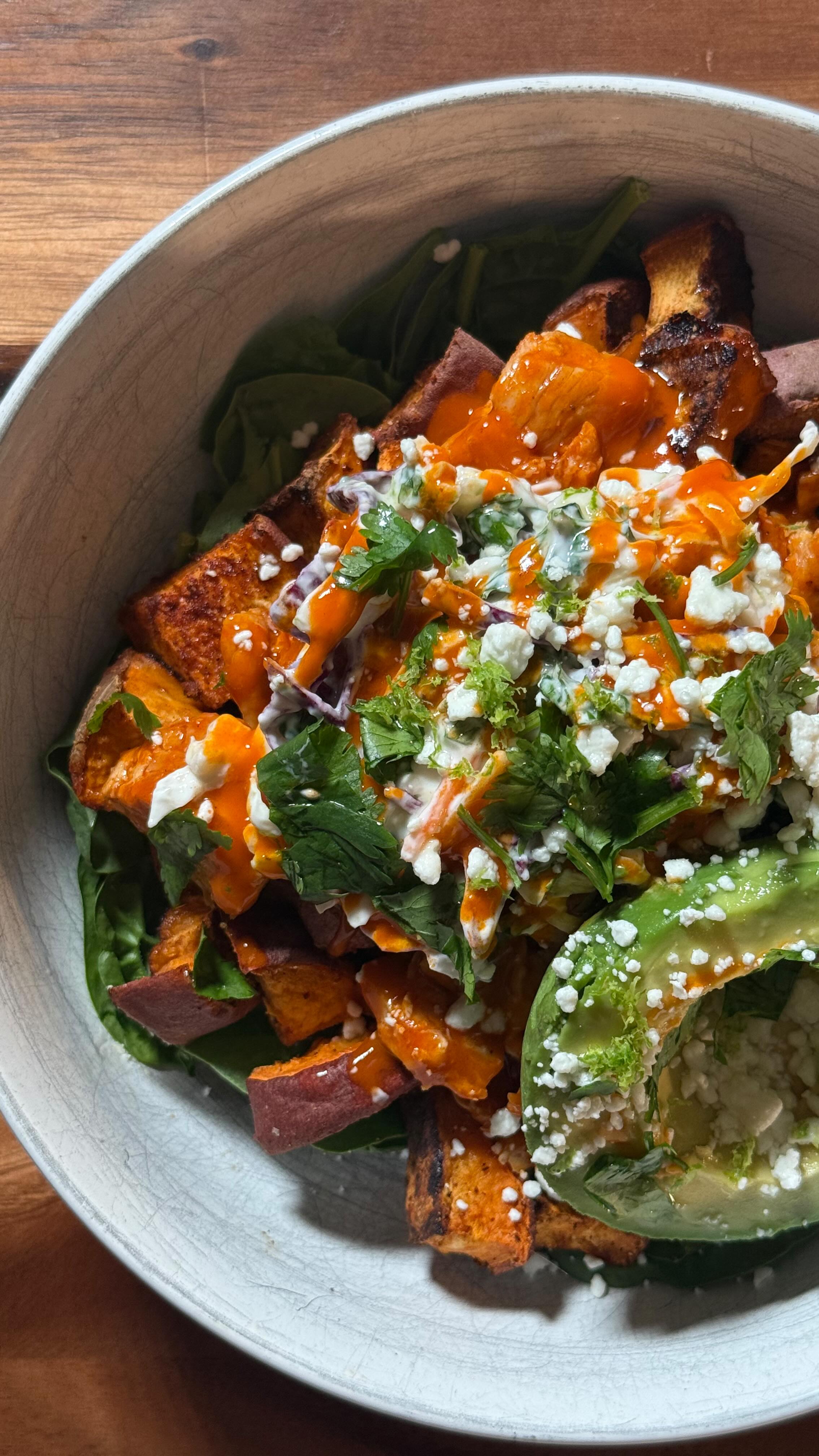 Instagram post by @ellie_teale for Primal Kitchen. Caption reads: Buffalo sweet potato bowl 🍠 full recipe in bio!!....