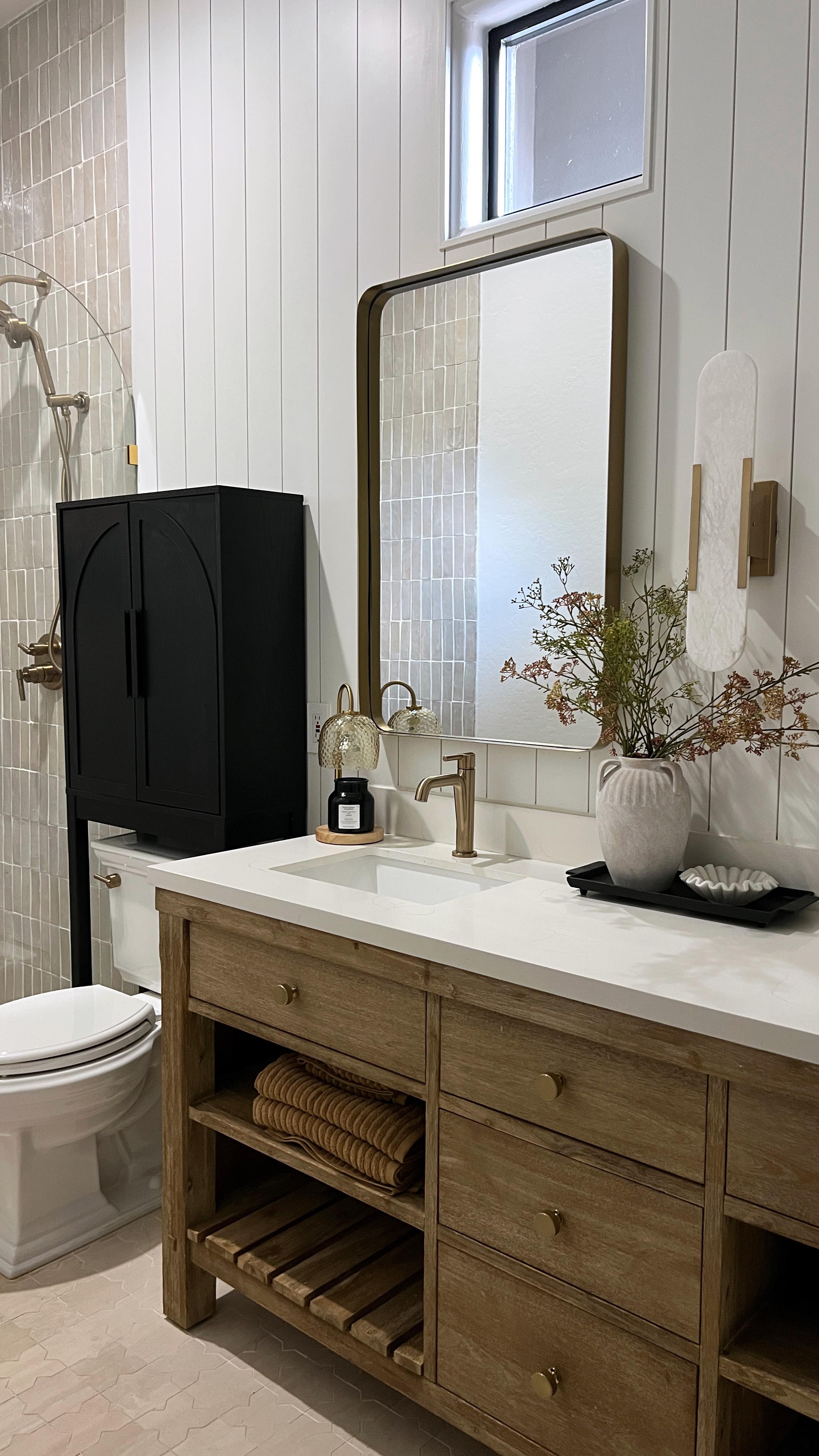 Instagram post by @elpetersondesign for Better Homes & Gardens. Caption reads: Sharing how to create a spa-like bathroom with....