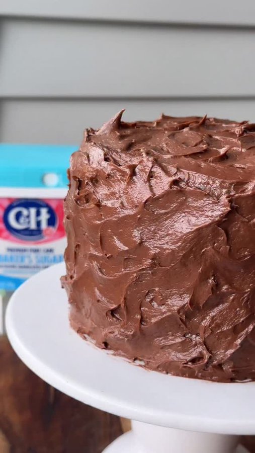 Instagram post by @eatatmaudes for Albertsons. Caption reads: Grab a fork, because we have a classic yellow cake....