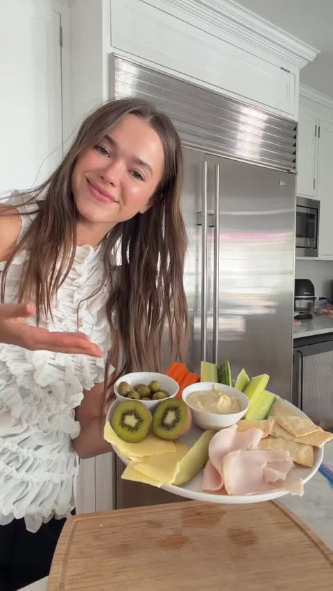 Instagram post by an influencer for Miami Twist. Caption reads: [...] Truffle Hummus @getmiamitwist Top @beaufille....