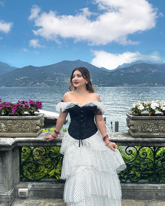 Instagram post by @rose_rawat for BCBGMAXAZRIA. Caption reads: Loving my Italian dream 🖤🤍 

Outfit-....