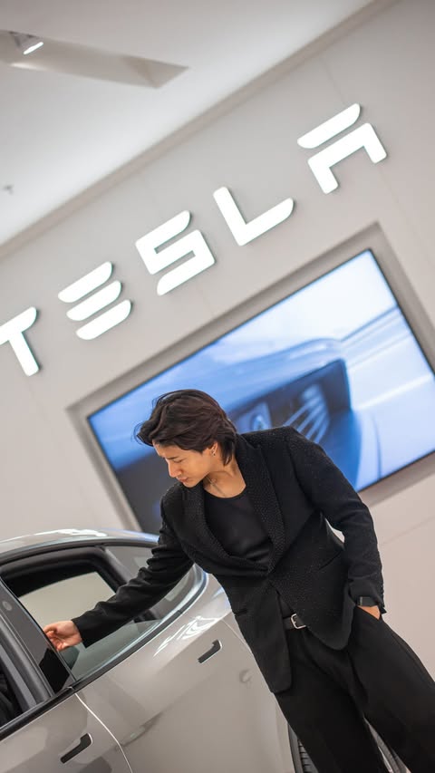 Instagram post by @nikhil_martoolia for Tesla. Caption reads: The future has officially arrived. ⚡🇮🇳 Tesla is....