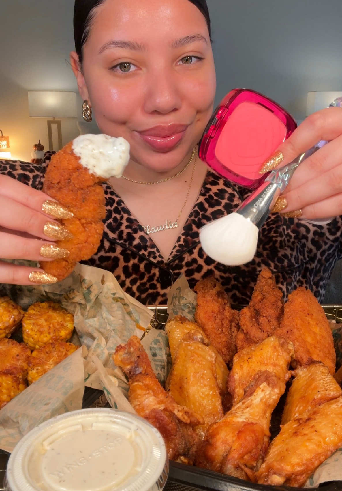 TikTok post by @claudiaeatsgood for Wingstop. Caption reads: @Wingstop for thanksgiving eve is the way to....