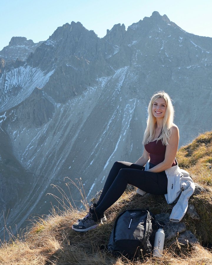 Instagram post by @janina_ejt for RevolutionRace. Caption reads: ad/ Out in the mountains with @revolutionrace....