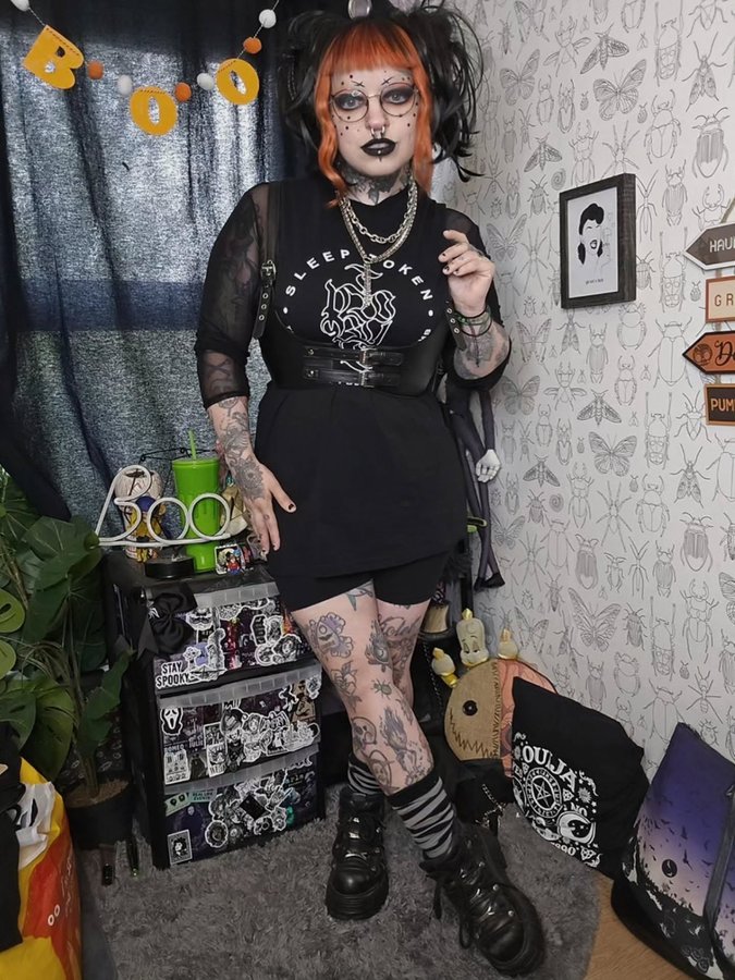 Instagram post by @emilyboo_official for Damaged Society. Caption reads: Repping my fave Sleep Token vest from....