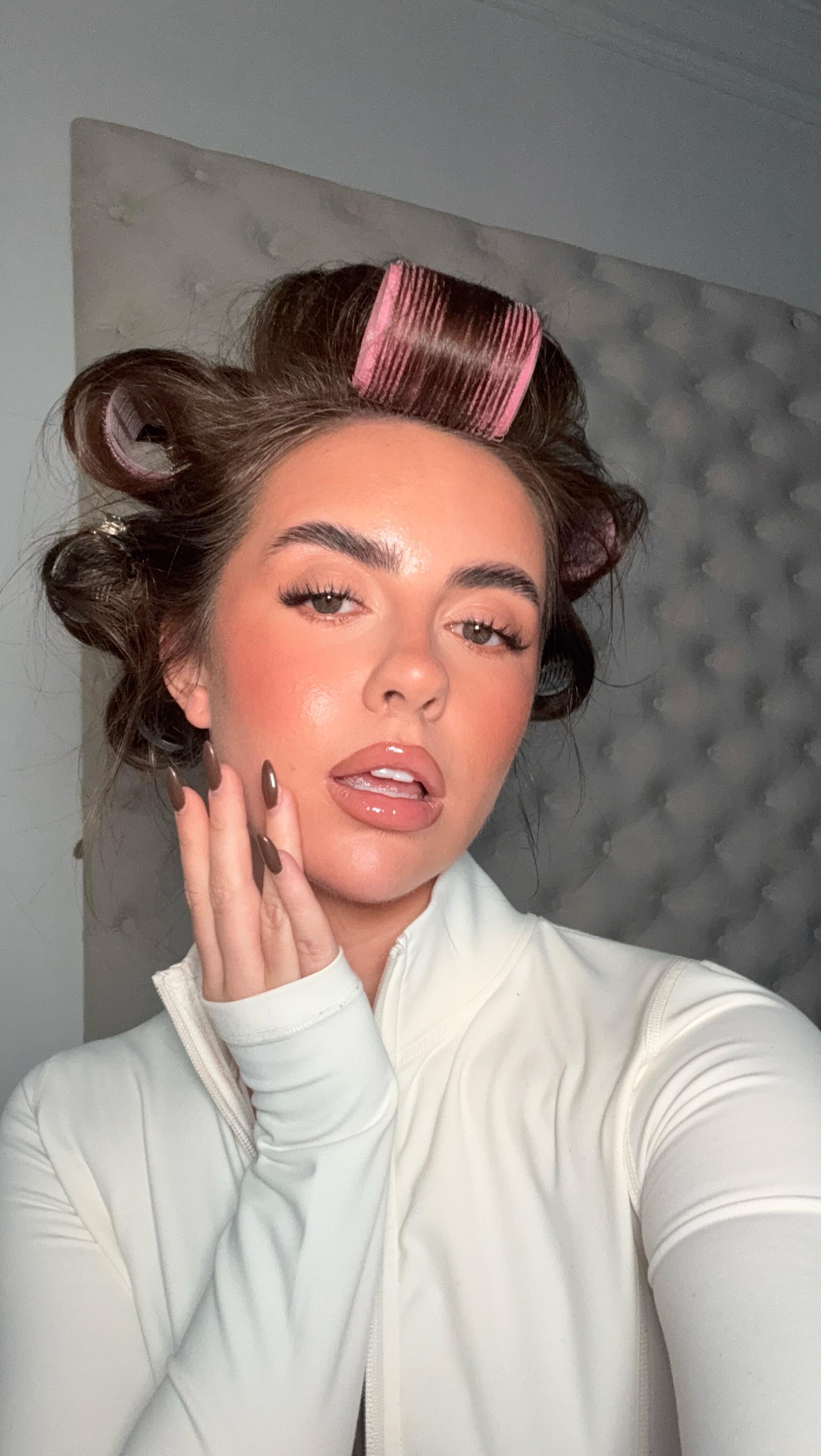 Instagram post by @livhudsonmakeup for Rare Beauty. Caption reads: the gloss of the season 🤎✨ 

@rarebeauty lip....