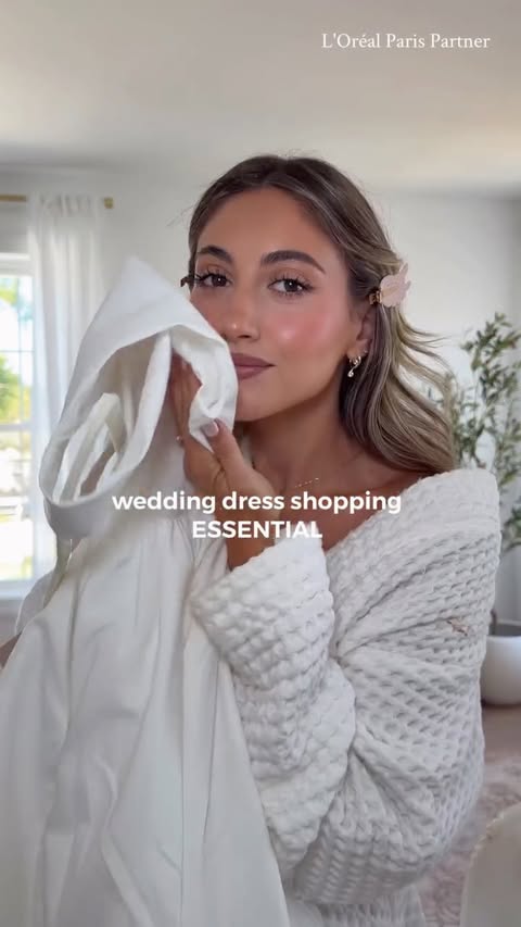 Instagram post by an influencer for L'Oréal Paris. Caption reads: wedding dress shopping MUST-HAVE is the....
