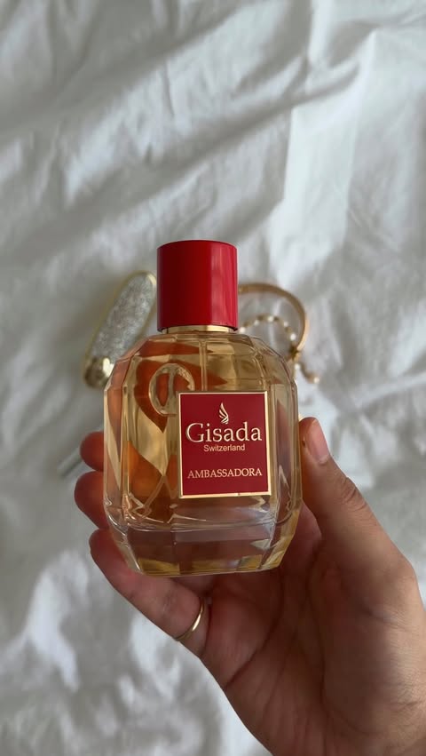 Instagram post by @a1eyley for Gisada. Caption reads: [...] outfit with the perfect fragrance from....