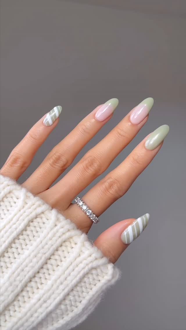 Instagram post by @nailsbyalsn for essie. Caption reads: minty striped nails for early Christmas nail inspo....