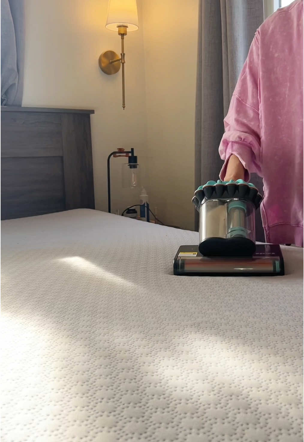 TikTok post by @realtalkcaitlin for Belife Clean. Caption reads: [...] I vacuum my mattress with the @Belife Clean....