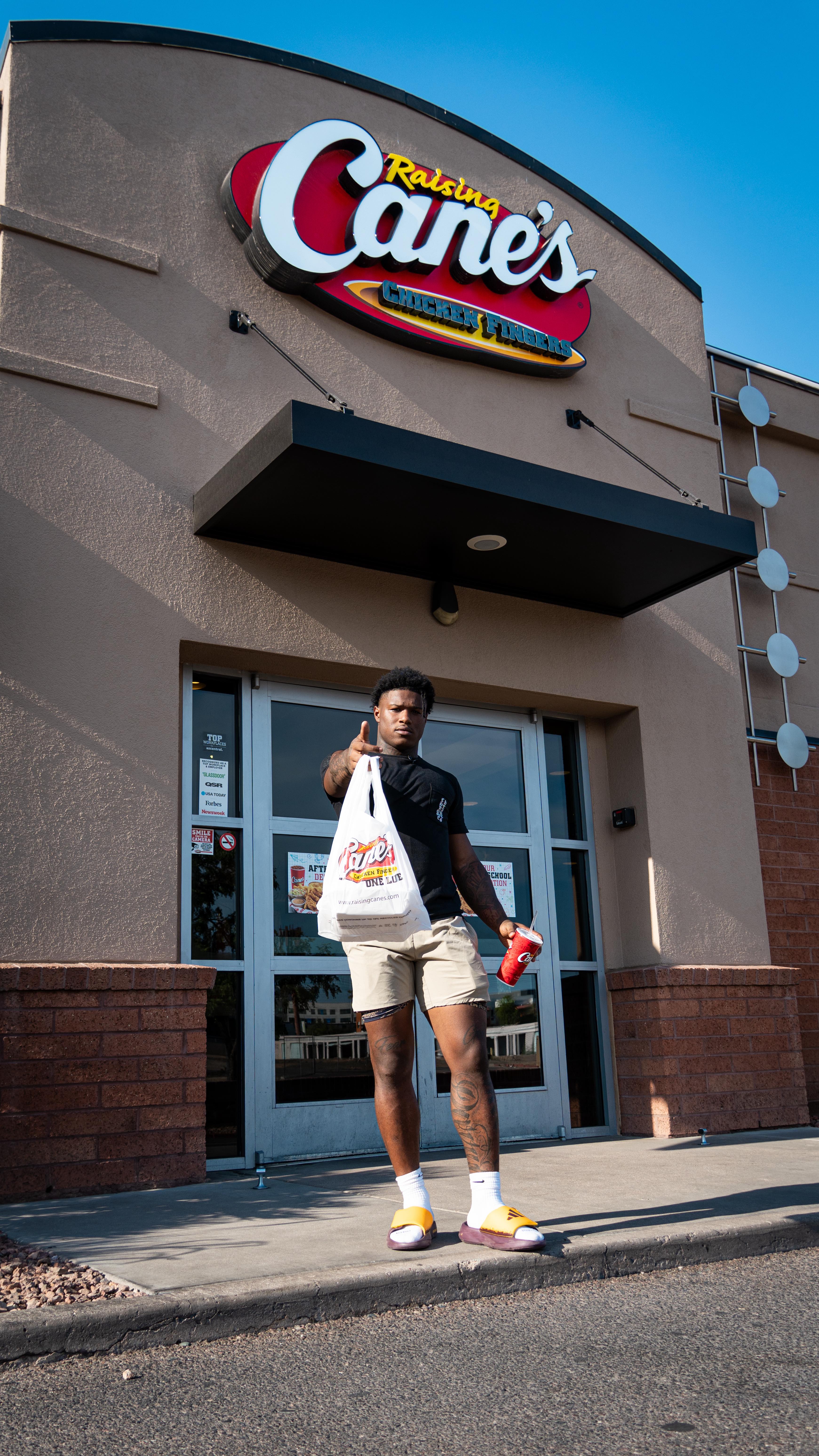 Instagram post by @bandaidleekfo3 for Raising Cane's. Caption reads: Focused, fueled, and game-day ready. 🏈....