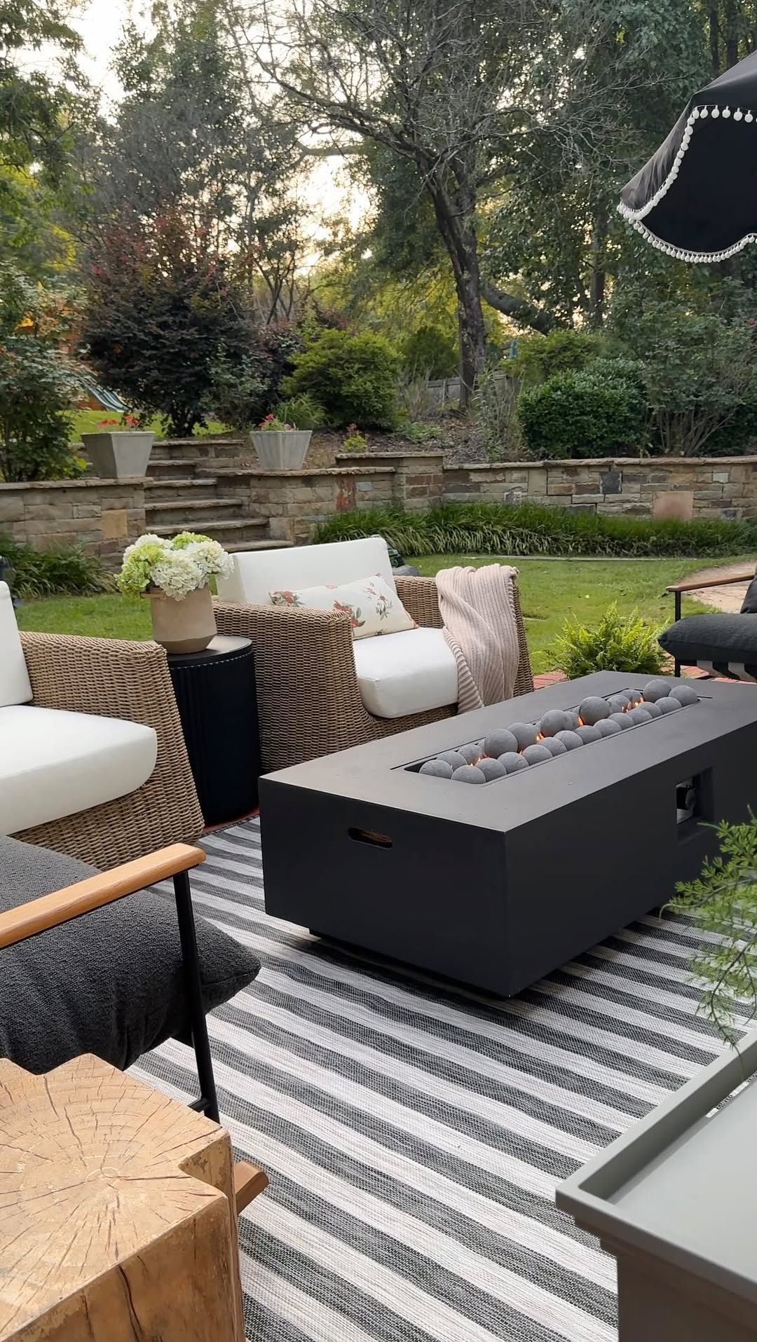 Instagram post by @designwithbernice for Wayfair. Caption reads: She’s not just a firepit, she’s the moment 🤌✨
....