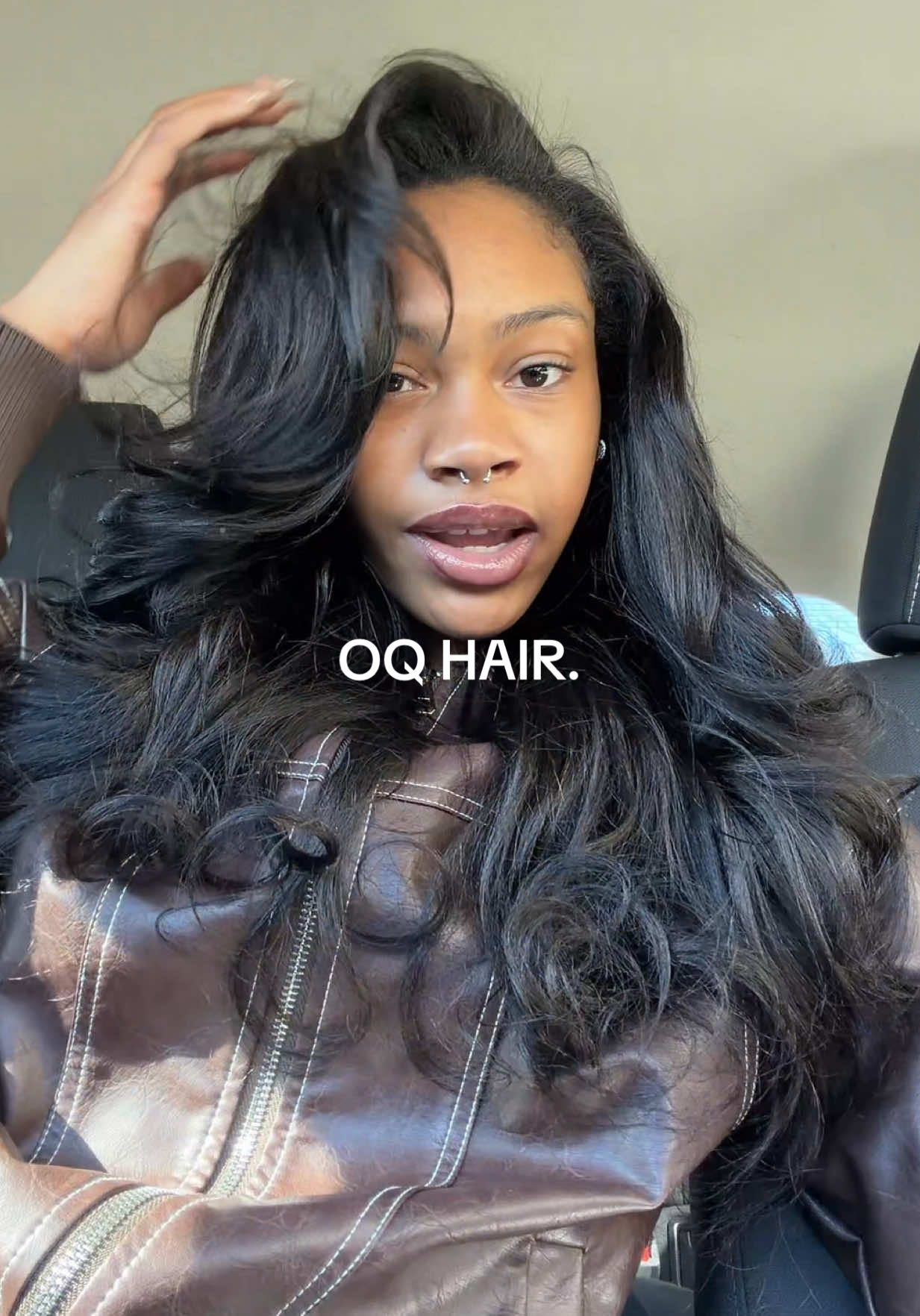TikTok post by @jairesemaj for OQHAIR. Caption reads: [...] Wig is chef’s kiss!! 😍😍🤏🏿 @OQHAIR....