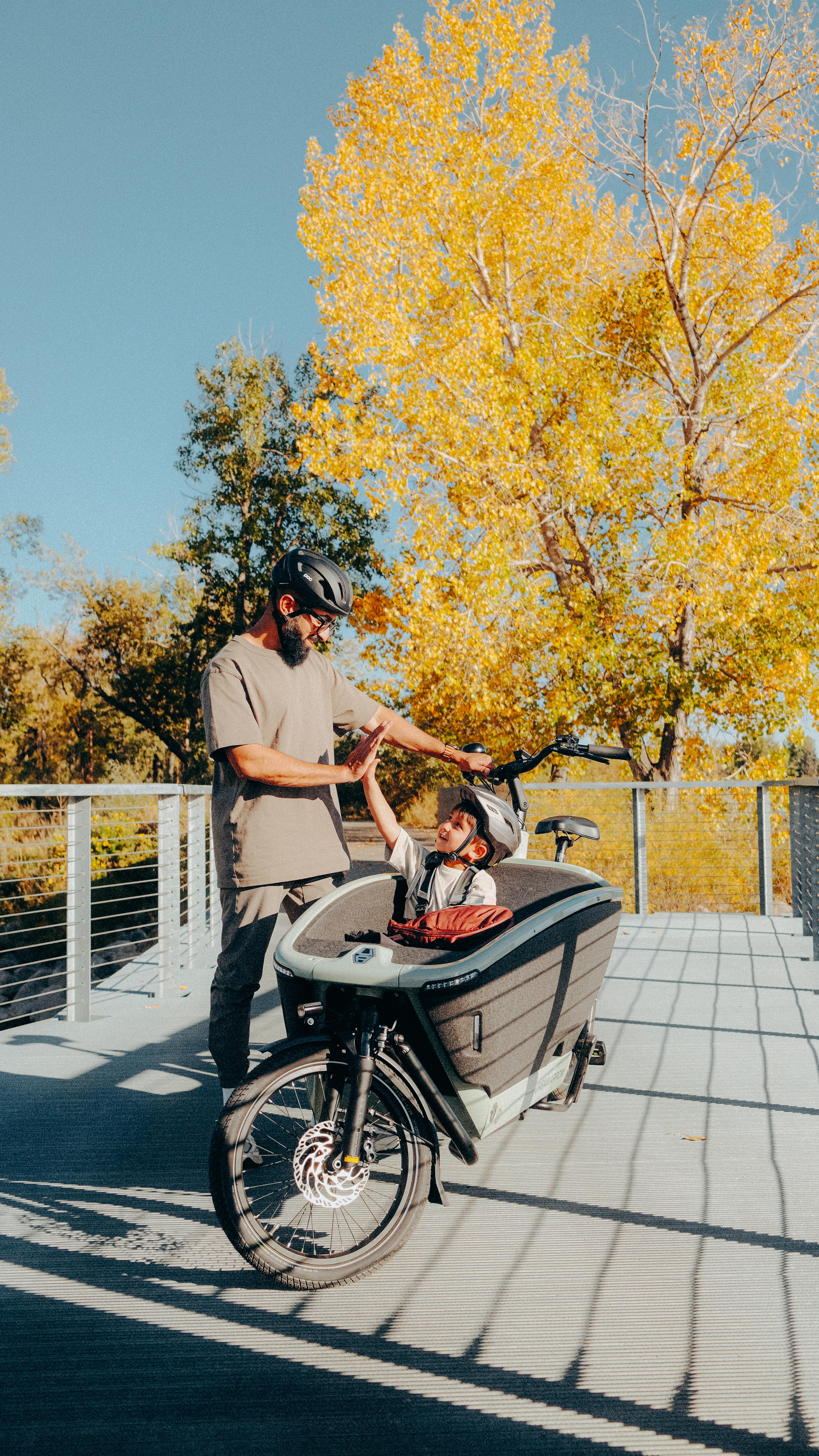 Instagram post by @rajeeeee for Travel Alberta. Caption reads: This fall, swap the car for a cargo bike and....