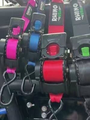 TikTok post by @footballmom.82 for RHINO USA. Caption reads: THINK PINK! 💗🎀 Rhino USA retractable ratchet....